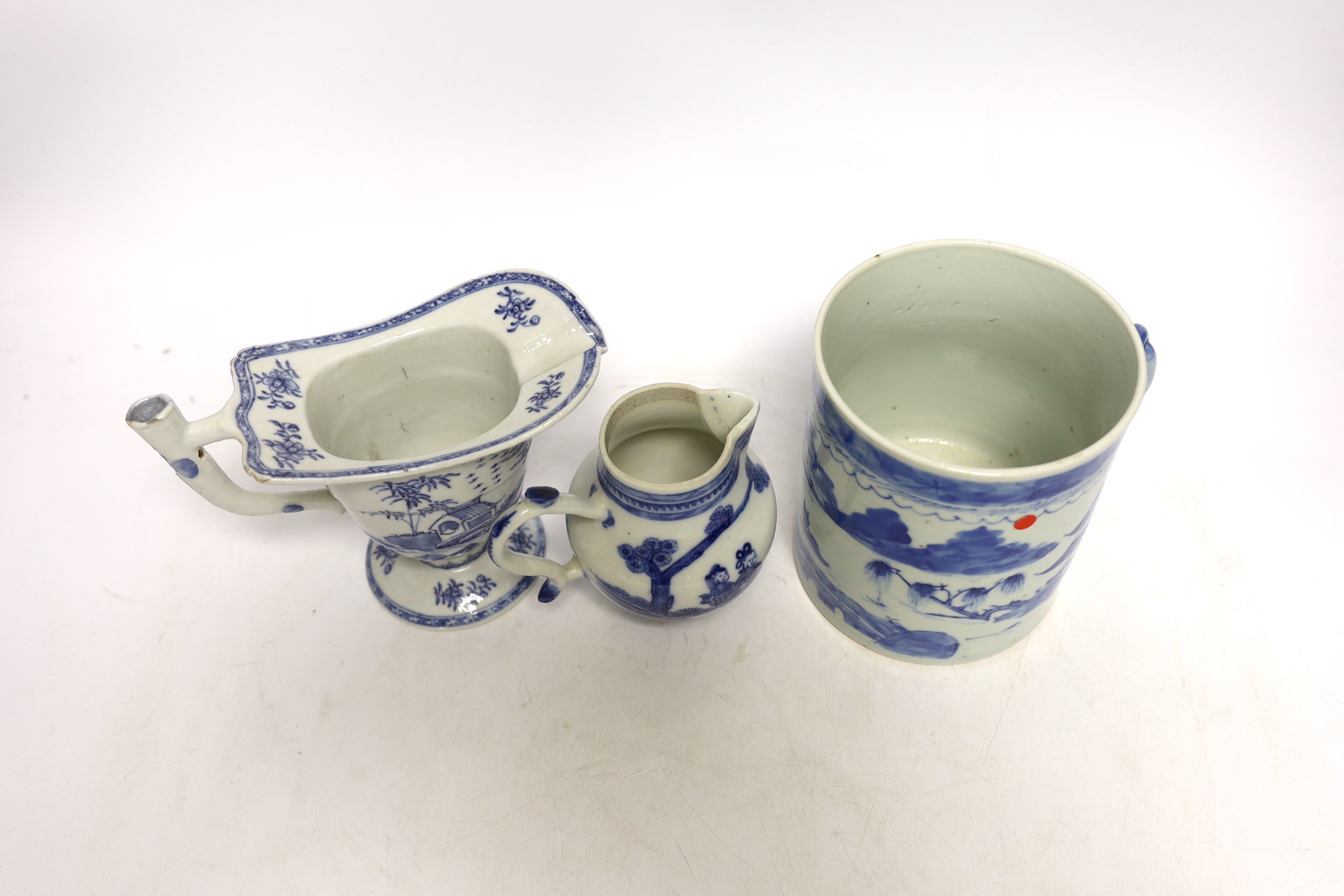 A Chinese blue and white mug and two jugs, 18th/19th century, largest 14cm high (3)